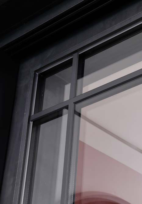 A narrow-frame panoramic aluminum sliding door system.